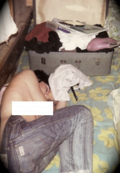 Penny Mallory homeless teenager lying half dressed in a small room with a suitcase by her