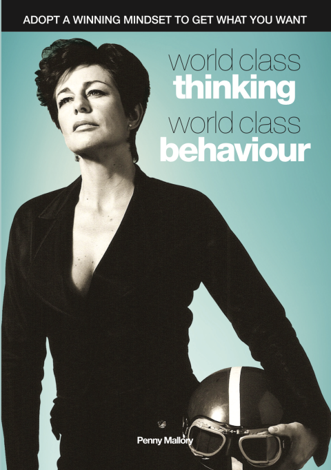 Front Cover of a book by Penny Mallory titled World Class Thinking World Class Behaviour. Features a black and white image of Penny holding a flying helmet with goggles on top.